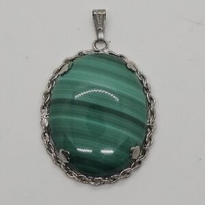 large green banded stone pendant with silver tone setting